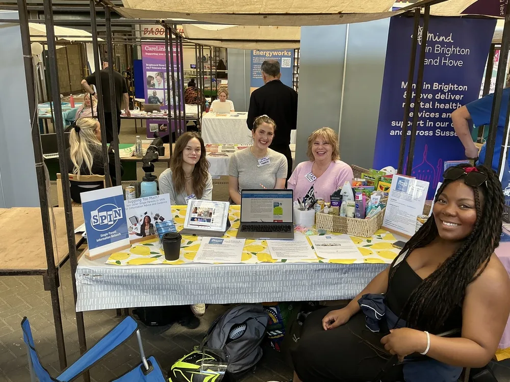 SPIN volunteers at the SPIN stall at a community event in Brighton