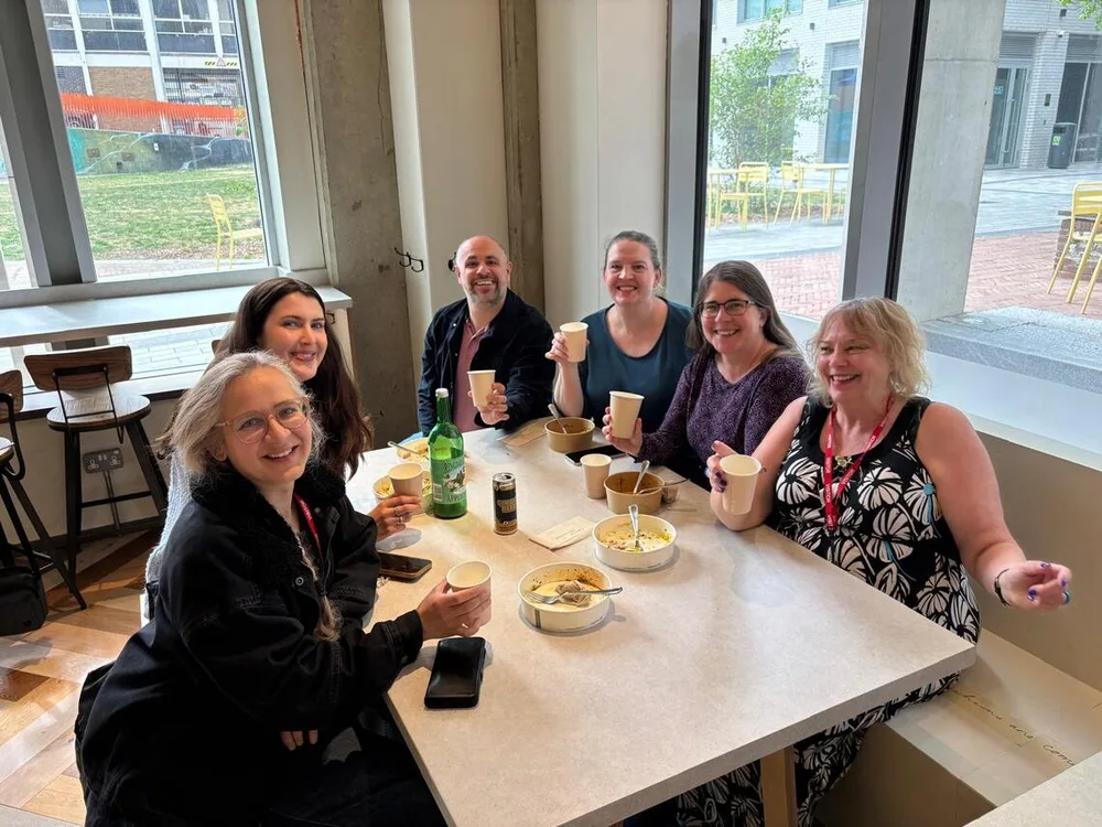 SPIN volunteers sharing coffee and lunch together